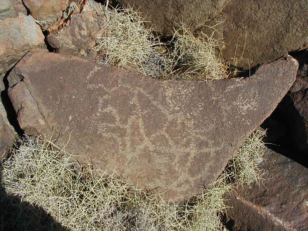 This piece appears to have fallen from the boulder above as it weathered.