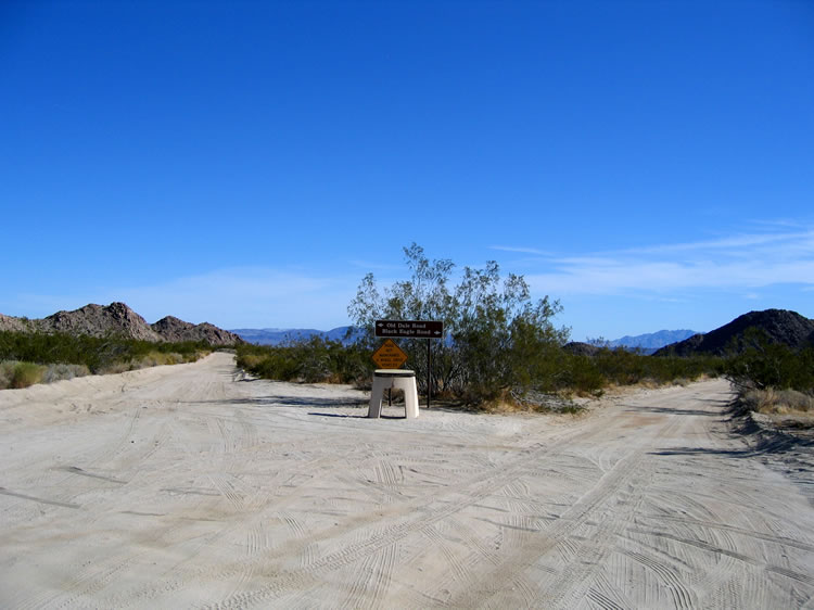 About six and a half miles north of Joshua Tree National Park's Cottonwood Springs Ranger Station, the paved Pinto Basin Road swings left and the two dirt roads seen here branch off to the right.  We'll be taking the road less traveled, the Black Eagle Mine Road.