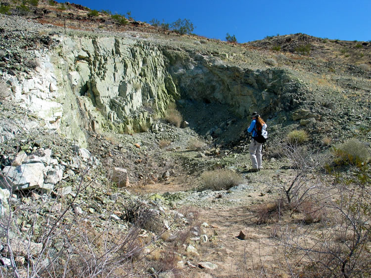 Along the way, Niki explores an open pit that uncovers a pocket of epidote.  The surrounding hills are littered with chunks of the stuff.