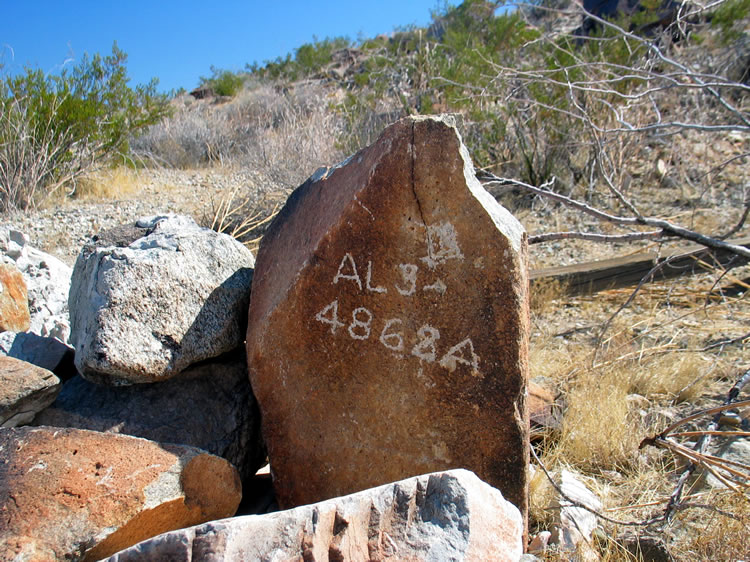 A corner marker turns up as we explore across the wash.