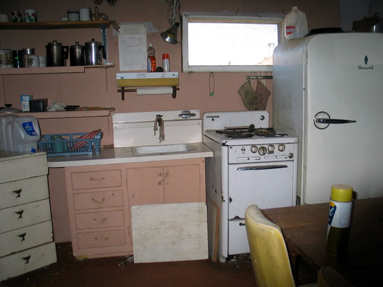 A wider angle look at the kitchen.  There is also a tiny bedroom and storage closet.