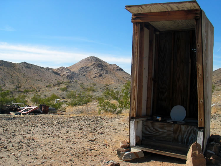 The outhouse has a great view of the surrounding hills.