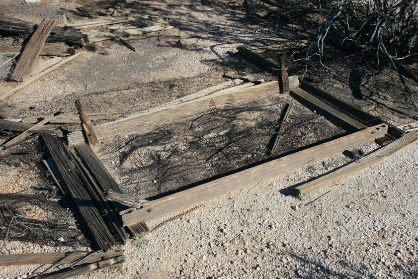 A closer look at one of the old bed frames that's part of the collapsed pen.