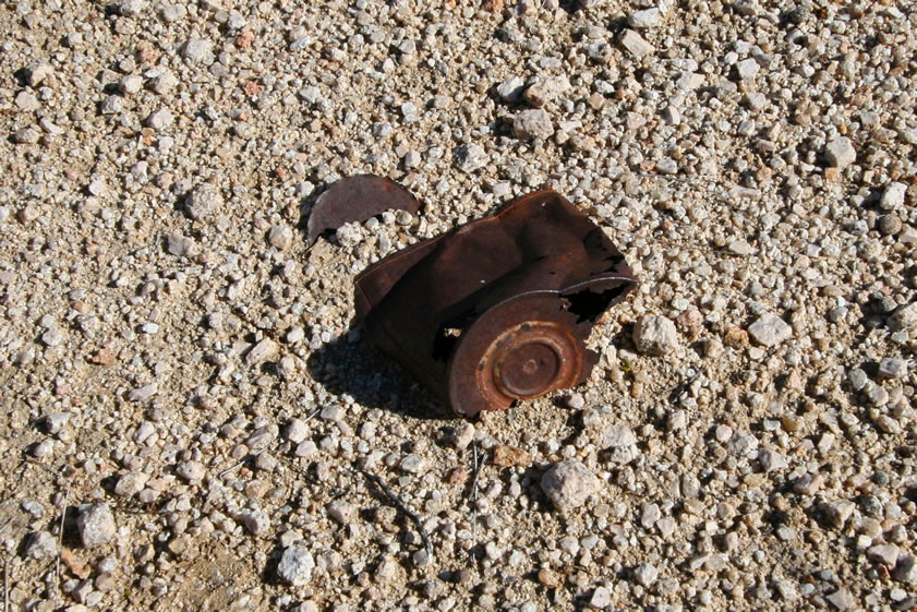 Numerous hole and cap style cans are strewn around the area.  These would tend to indicate a date from the late 1800's to early 1900's.