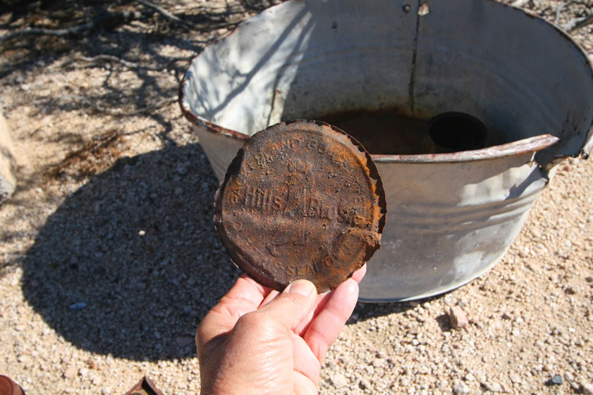 An even closer look at the coffee can lid shows that it's from a Hills Brothers Coffee container.