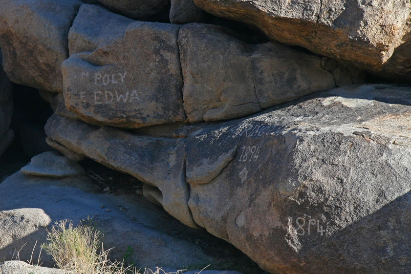 Here's a closer view of the two names.  Notice that to the right you can just see part of an 1894 inscription.