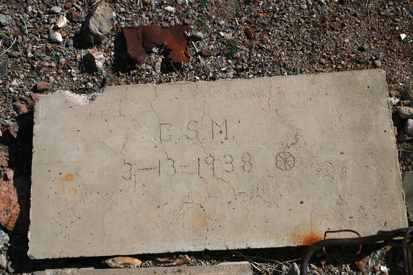 One of the slabs has some neatly inscribed initials, a 1938 date, and a symbol.