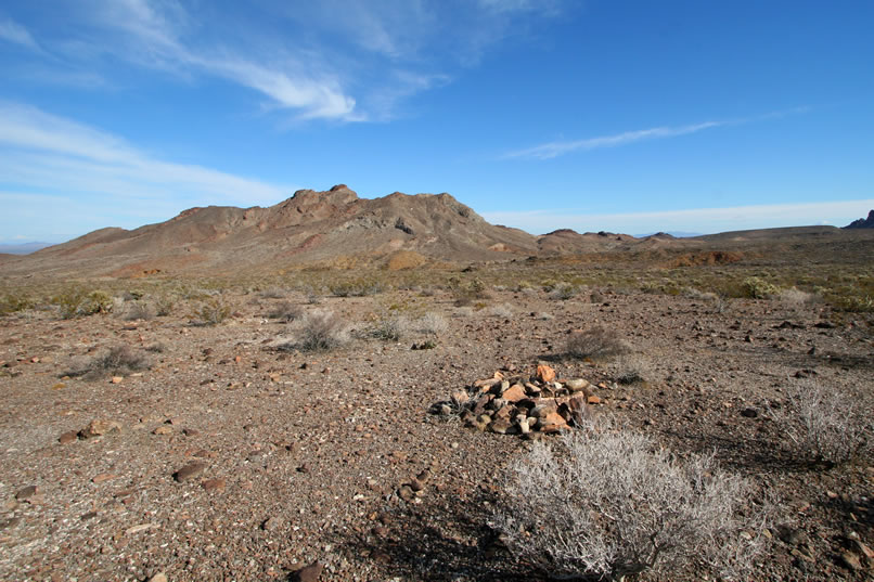 From the cabins, we set out for the short hike down to Carson's Well.  Along the way, we make a detour to check on a grave site shown on the topographic map.  Once at the GPS location, we find no marker but only this lonely pile of rocks.