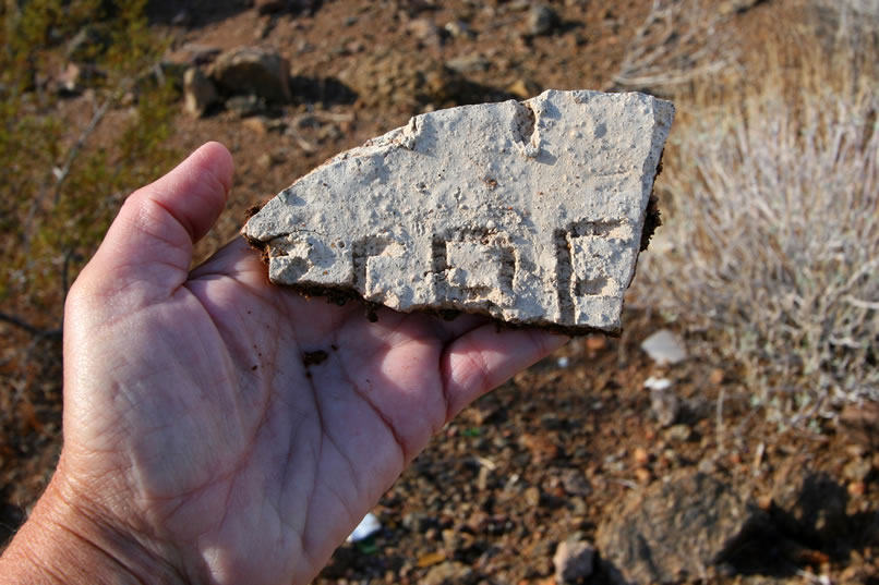 Another inscribed fragment is found nearby but there's not enough of it to decipher.