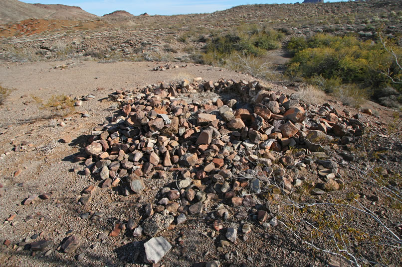 A short distance away, on the high bank overlooking a wash, is a crumbling stacked stone ruin.  Carson's Well was probably located in the thick mat of mesquite and acacia in the wash below.