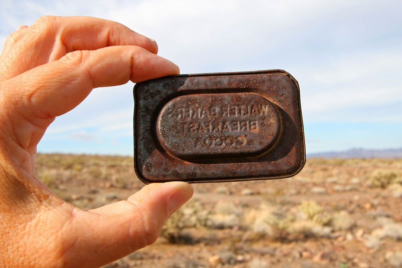 If you're good at reading backwards, you can see that this is the lid from a container of Walter Baker's Breakfast Cocoa.  This company was started in the late 1700's and remained quite popular into the early 1900's.