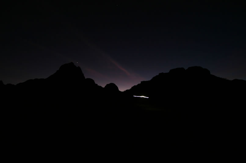 That bright wavy line is Niki's headlamp as she hikes back down the trail toward camp.