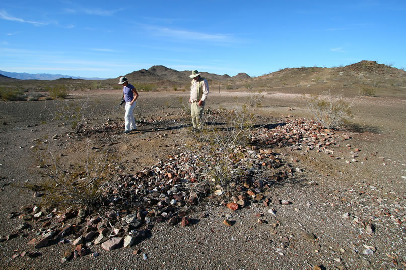 Once back at the vehicles, we join Mohave in checking out the foundation outline of the burned out mine cabin.  Lots of interesting small bits of twisted metal and melted glass still remain.