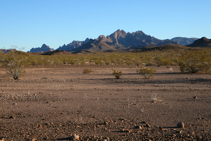 Late afternoon shadows begin to creep into the nearby hills.