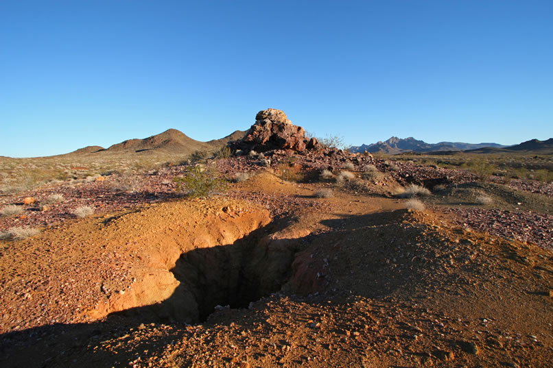 Several pits and trenches hint at past attempts to find mineralization associated with Quartz Knob.