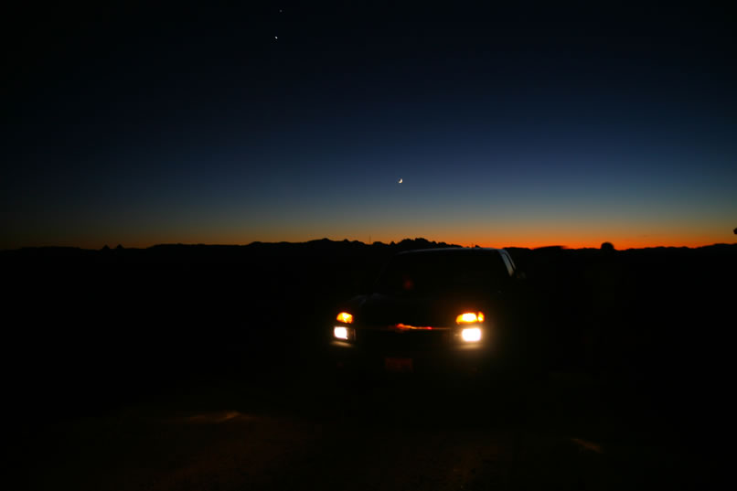 As we near the highway, we stop to view the astronomical conjunction of Venus, Jupiter and the Moon.  Admittedly, we've missed the peak where all three are very close together.  Still, you can see Venus up to the left of the Moon and, if you have sharp eyes, you can just discern Jupiter right above Venus.  It's been a marvelous trip and we hope that you've enjoyed it as much as we have!