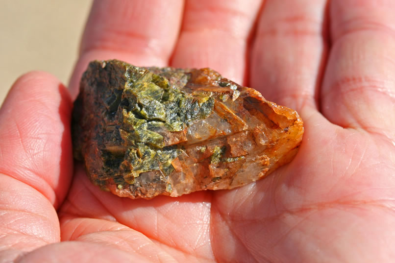 Nearby a very colorful rock catches our eye.  Niki's guess is quartz and epidote.