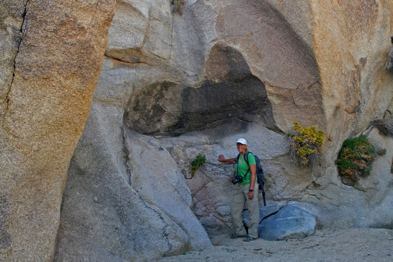 Yes!  Finally, we've found it.  Notice the polished rock chute high above Jamie's head.  This is the lower dryfall that we've been looking for.  All we have to do now is find a way above the fall and look for the next one.  That one, hopefully, will have a few petroglyphs near it!