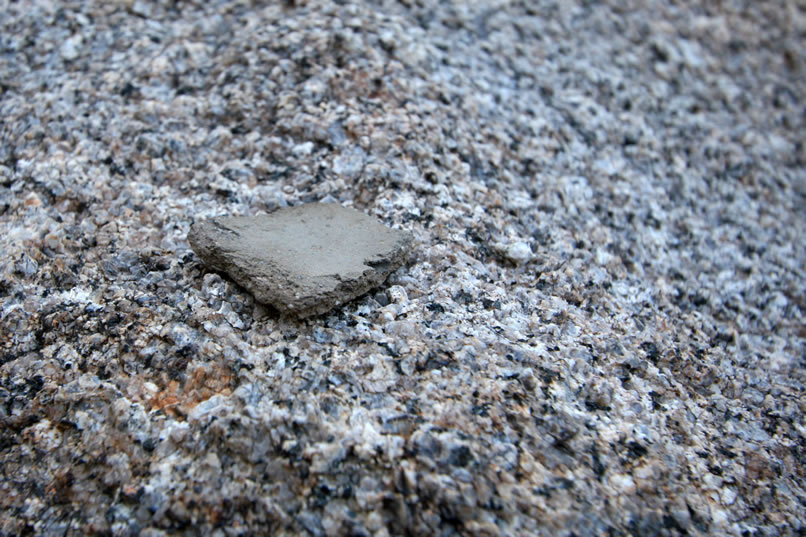 Some continued hunting in the shadowed interior of the shelter turns up a single piece of pottery.