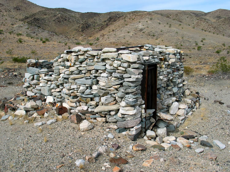 The stacked stones have traces of mortar helping to hold them together.