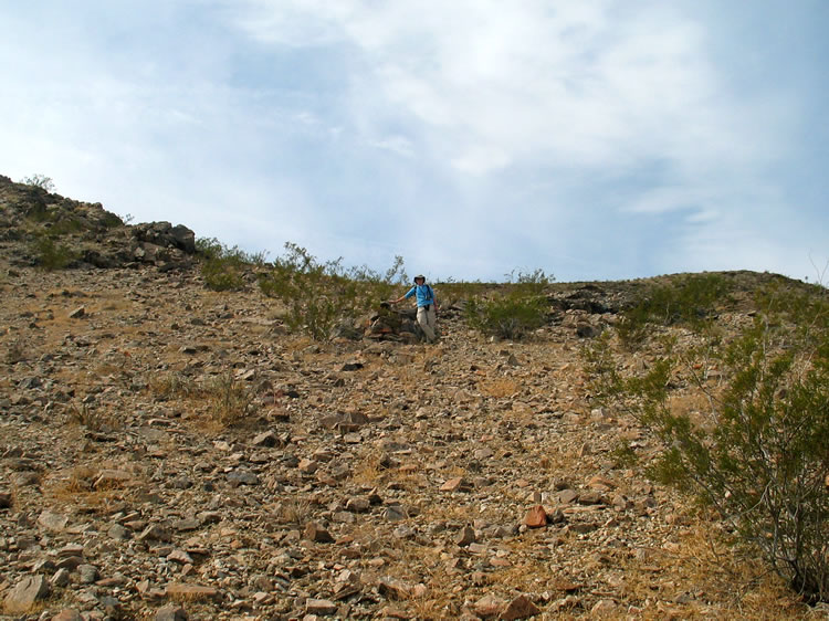 As we continue up the trail we spy a corner marker above us on the hillside.