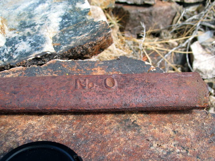 Near the fireplace we find a short section of a heavy oval bar.