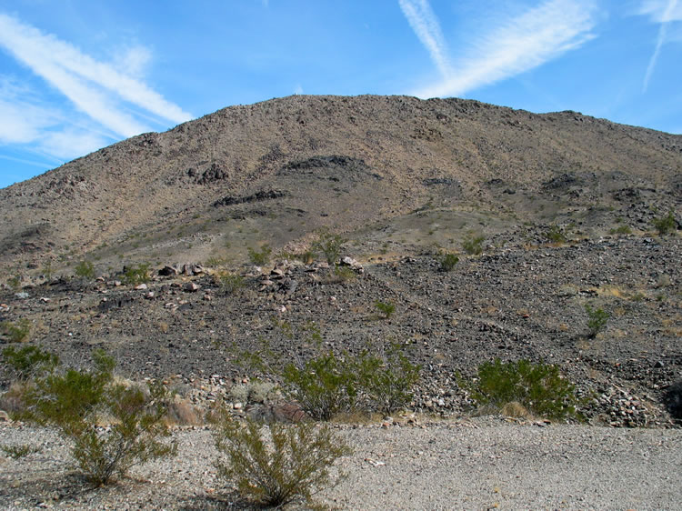 A well worn trail leads over the hill.  Since we haven't found the mine itself yet, we figure that the trail will lead to it.