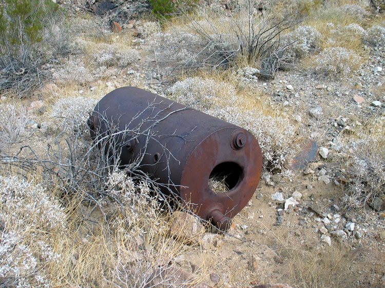 The trail drops into another wash and we find a large tank.