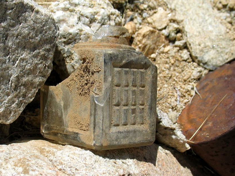 This solidly built little glass container looks like an inkwell.