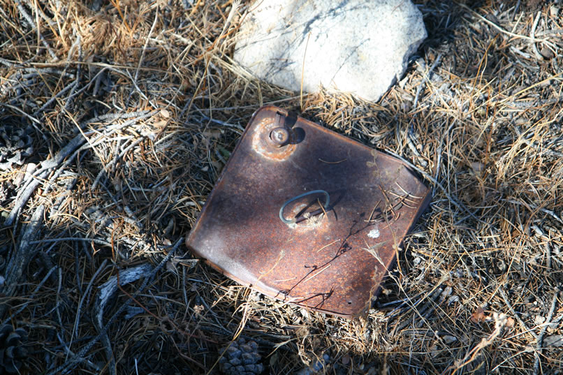 The soldered spout on what might be a kerosene can appears to be from the early 1900's.  During this time cattle were a big business here so this spot might have been a cowboy camp.