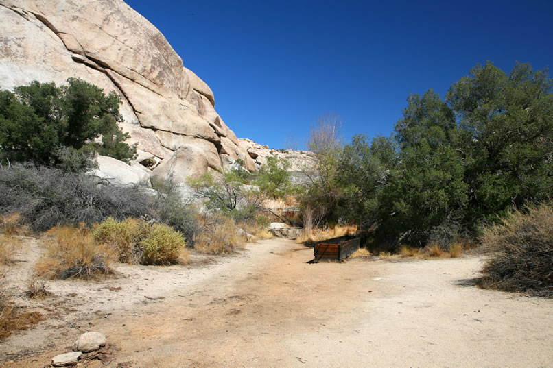 Another hike has brought us to the base of Barker Dam.  You can see the remains of a wooden watering trough for the long absent cattle that once relied on this dam for water during the dry summer months.