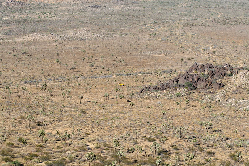 Thanks to the magic of telephoto lenses, you can see the yellow blob of Jamie's Xterra Off Road, nicknamed the Desert Canary.