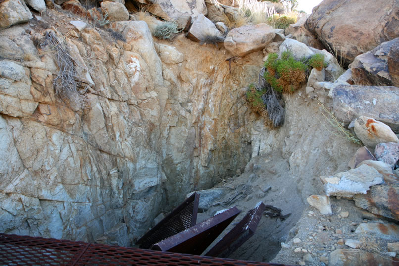 As we descend, we get some more views of the dangerous results of the failed attempt to grate these diggings.