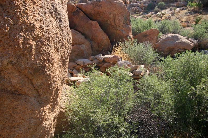 The first thing that we spot is a stacked rock affair that might have been a fireplace.