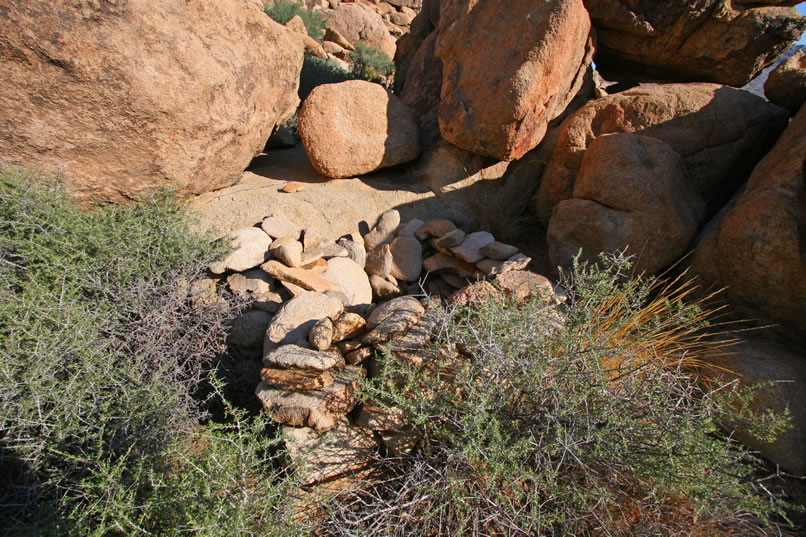 Wire wrapped around nearby rocks might have been anchor points for a tent cabin.