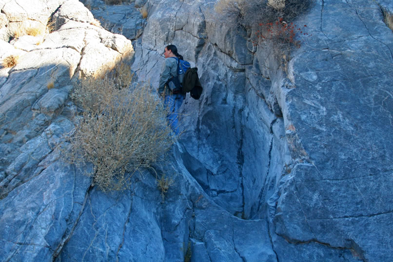 Alysia is next to enter the rocky defile.