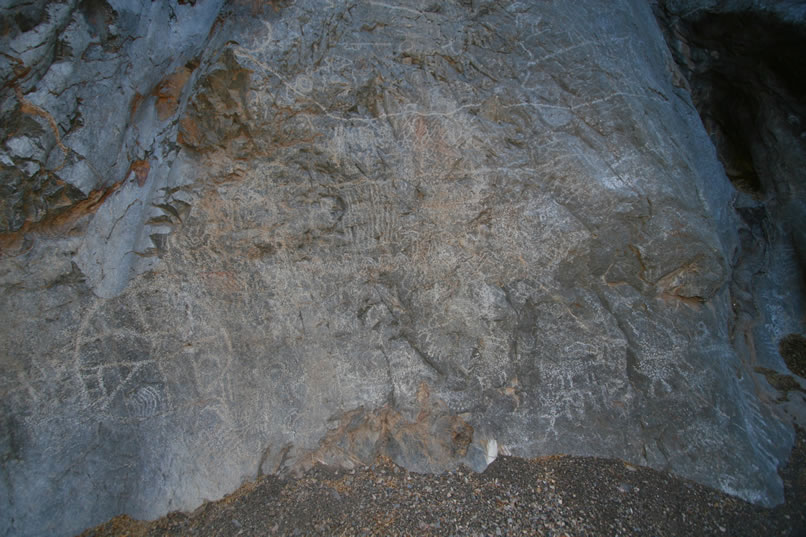 As you let your eye wander over this panel you can see bighorn sheep, human stick figures, and parts of long horizontal meander lines which wrap two-thirds of the way around the entire bowl.