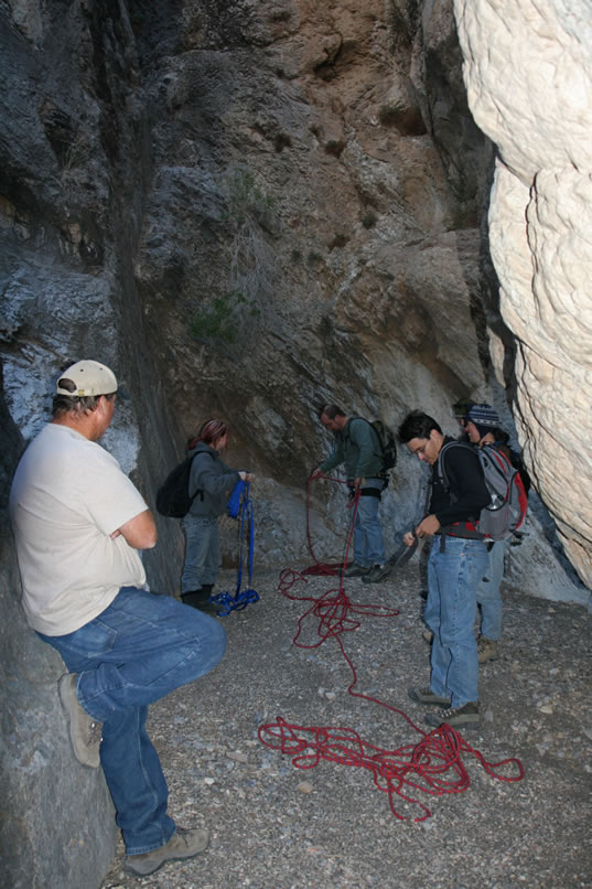 Once we're all safely back at the base of the two difficult chutes, we coil up the ropes and continue downward.