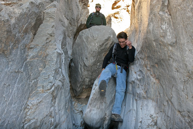 At the big chock stone, Guy makes it down without any webbing at all.