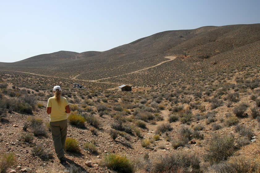 This is a view looking back at the cabin from a mine shaft further up the wash.  Notice the headframe in the distance.  We'll head up that way shortly.