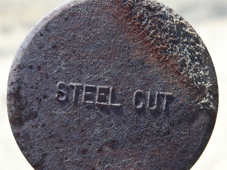 The term "steel cut," shown here embossed on the top, was used to describe both coffee and oatmeal.