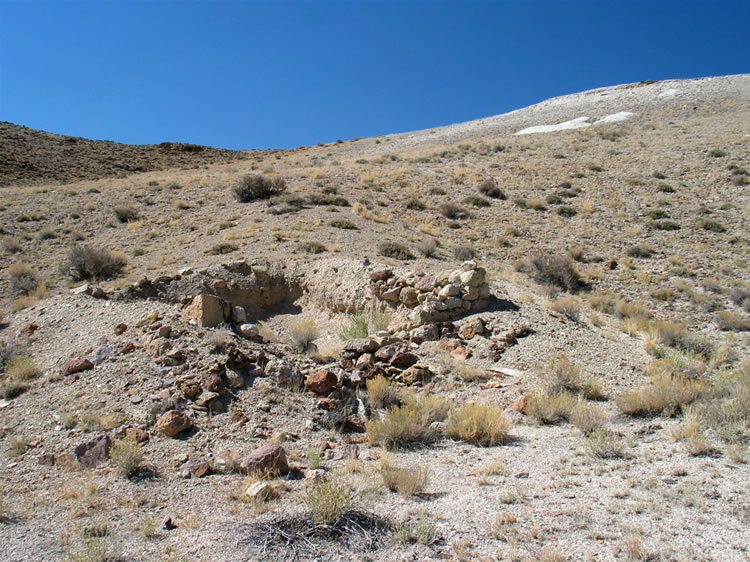 We make a detour up a rough two track to check out a "ruins" notation on the topo map.  It turns out to really be a ruin!  Little is left of the structure and no interesting debris are found surrounding it.