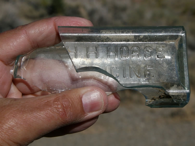 Part of an old embossed medicine bottle for H.H.H. Horse Medicine.  I guess even horses get hoarse.  Heheheh.