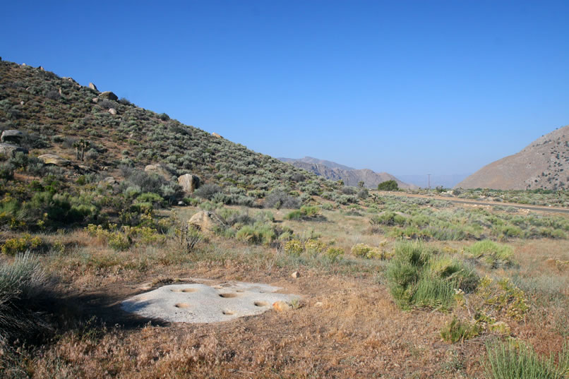 To our surprise, we come upon a low granite outcrop with numerous bedrock mortars.