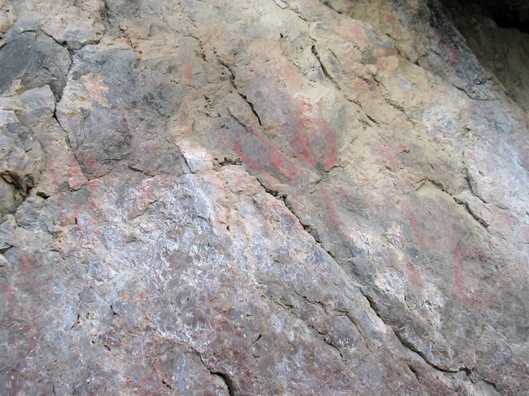 Here's another grouping of faded red pictographs.  It would be easy to pass these by without noticing them.  Most surviving pictographs are in rock shelters and caves that protect them from the elements.  All of these that we've photographed on this exposed rock face, though, are fighting a losing battle.