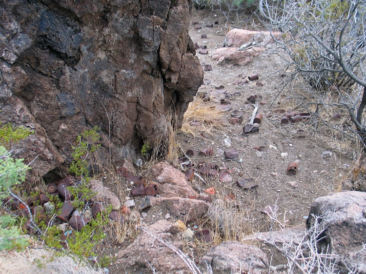 Near the arrastra we find a scatter of hole and cap and Sanitary cans, showing that this spot had been occupied in the late 1800's and early 1900's.  In fact, some of the earliest mines in the area date back to the 1850's.