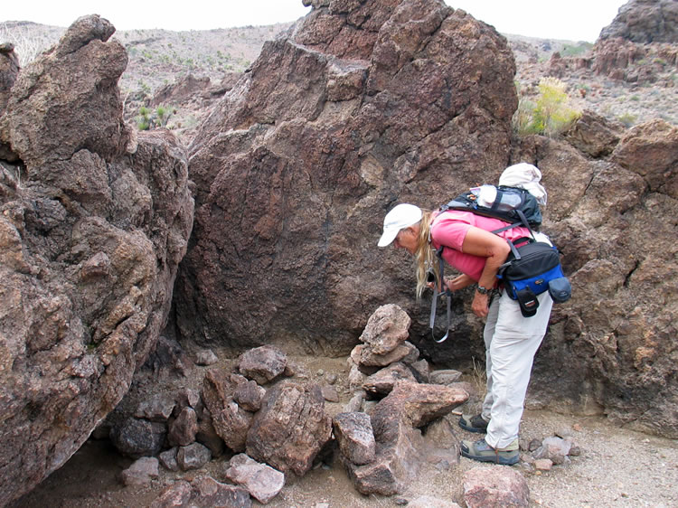 Above the shelter are the remains of a small rock enclosure.