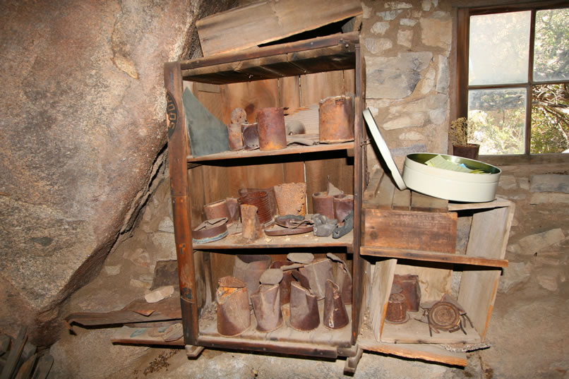 Another view of the cupboards, shelves and window.