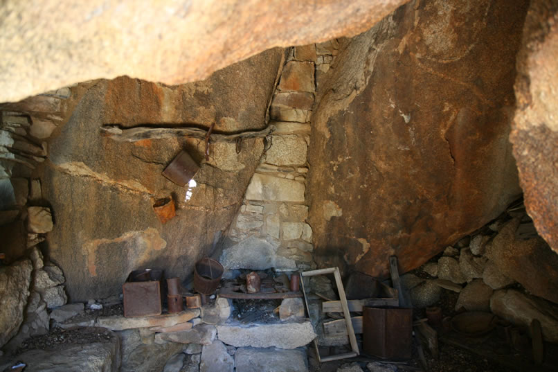 Here are some closer looks at the masonry and iron stove and the far wall of the cabin.