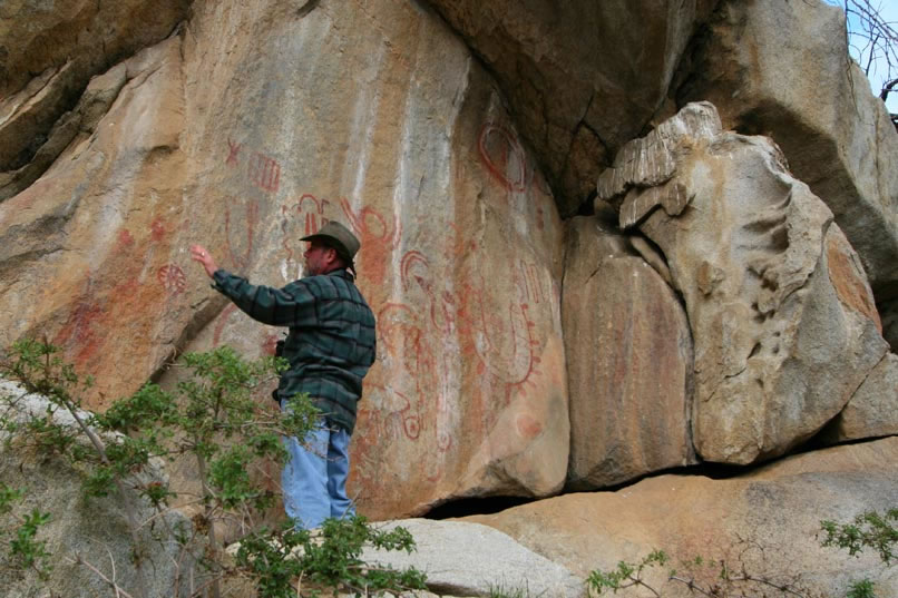 He relates that the pictographs here are done mostly in red, white and black pigments.  They are unusual because of their size, with some elements over five feet tall and wide.  The panels are also densely packed with pictographs of different ages.  Some, in fact, are so weathered that they can be seen only by viewing them in the D-Stretch color enhanced roll-overs that you can access in the following images.